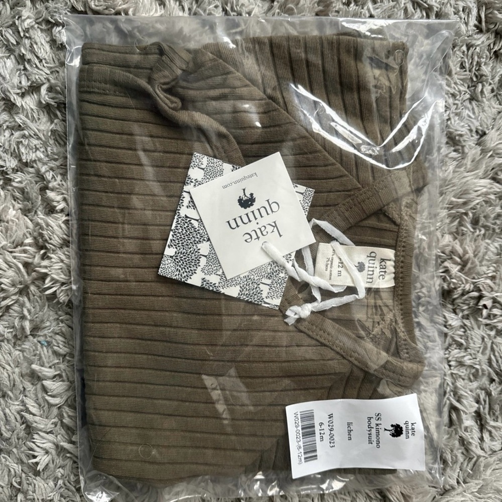 Kate Quinn Onesie